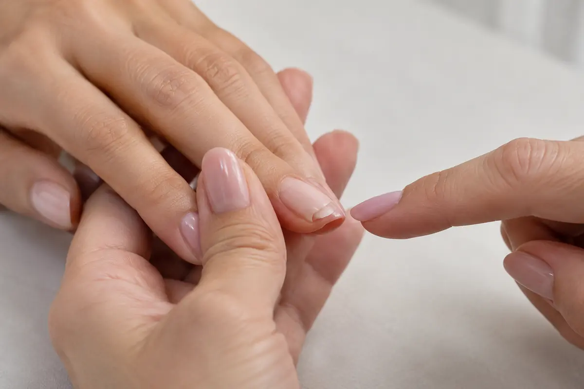 Professional discussing a recurring manicure problem